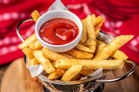 Image of hot chips with tomato sauce